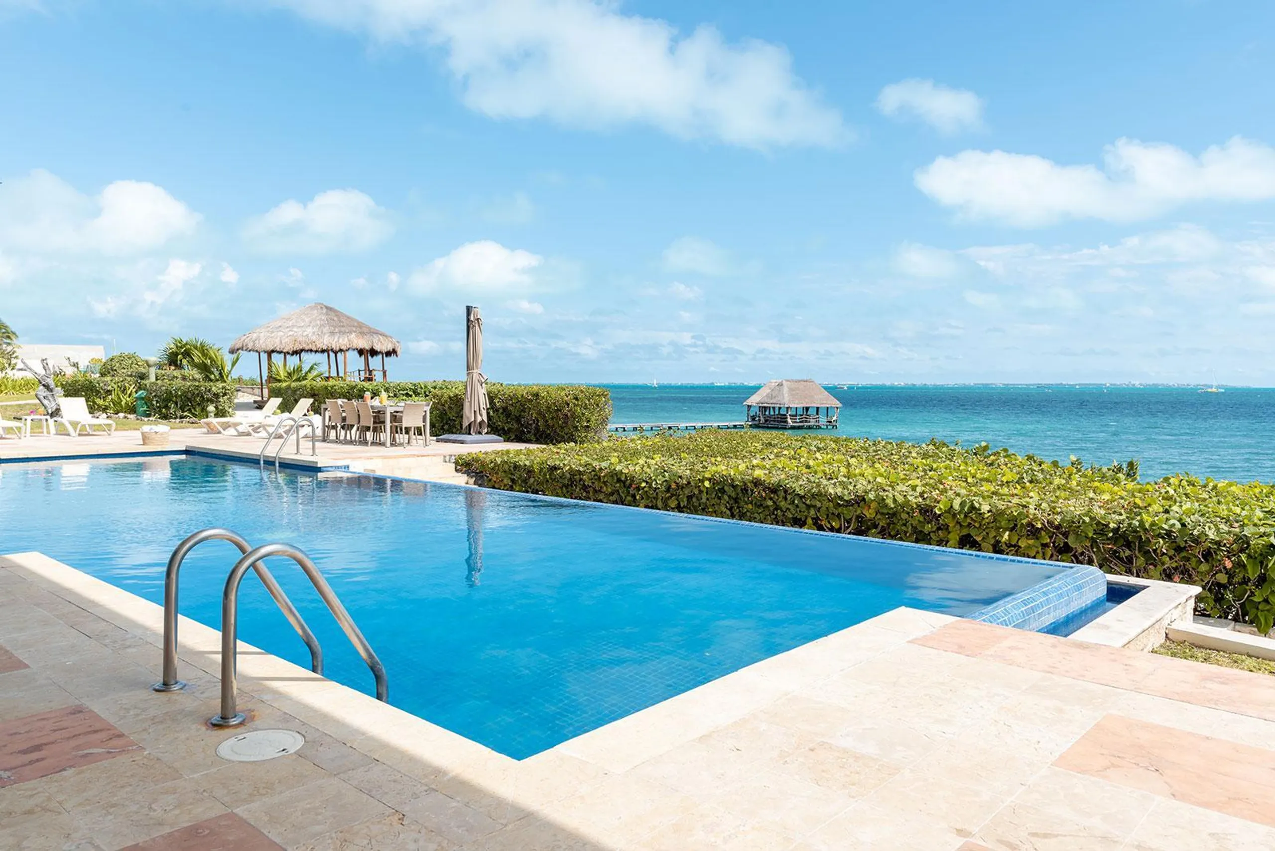 Pristine Facade Oasis with Ocean-Facing Pool — photograph 5