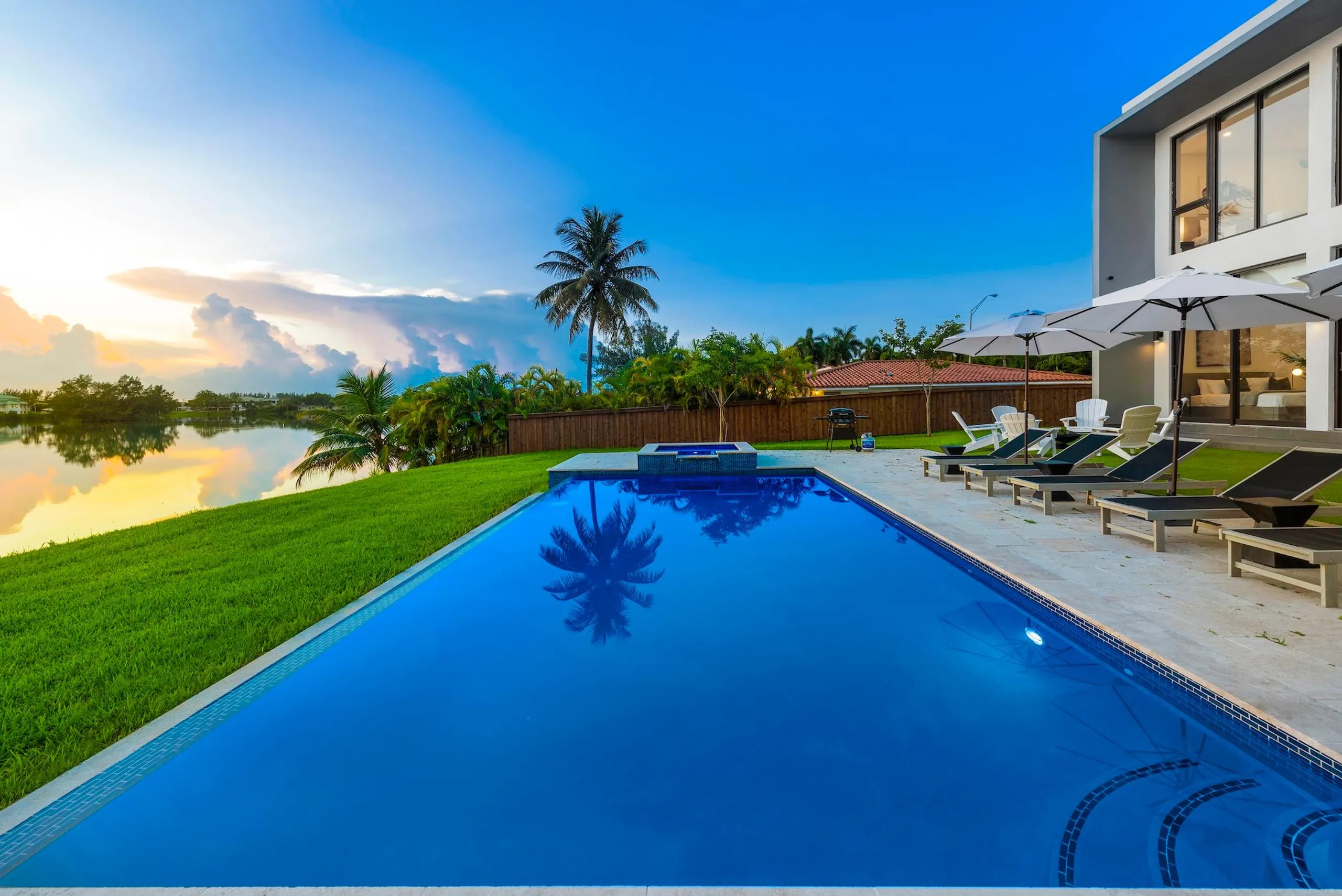Lakeside Lumiere Estate with Resort Pool — photograph 2