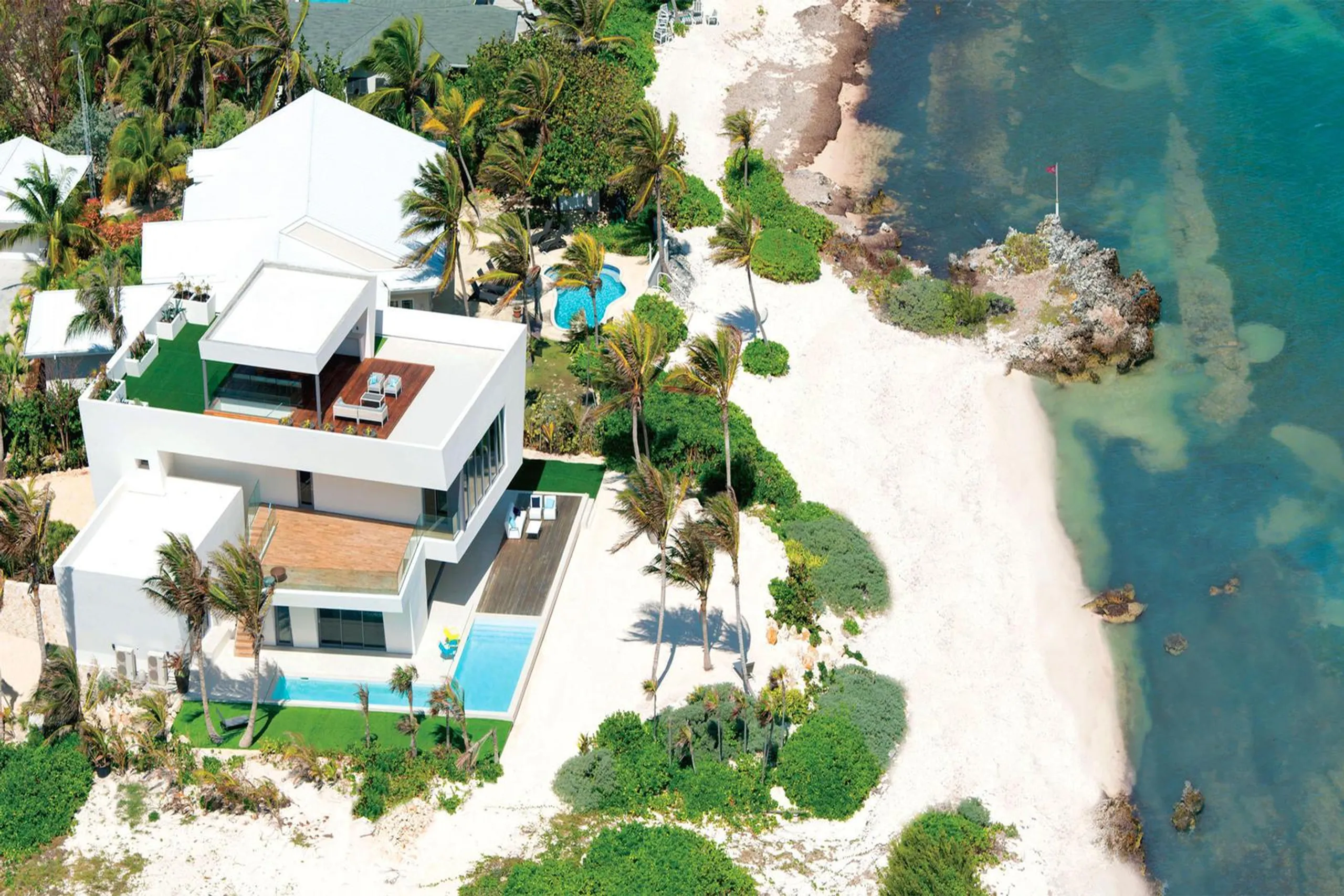 Modern Beachfront Estate with Private Resort Pool and Beach, Rum Point