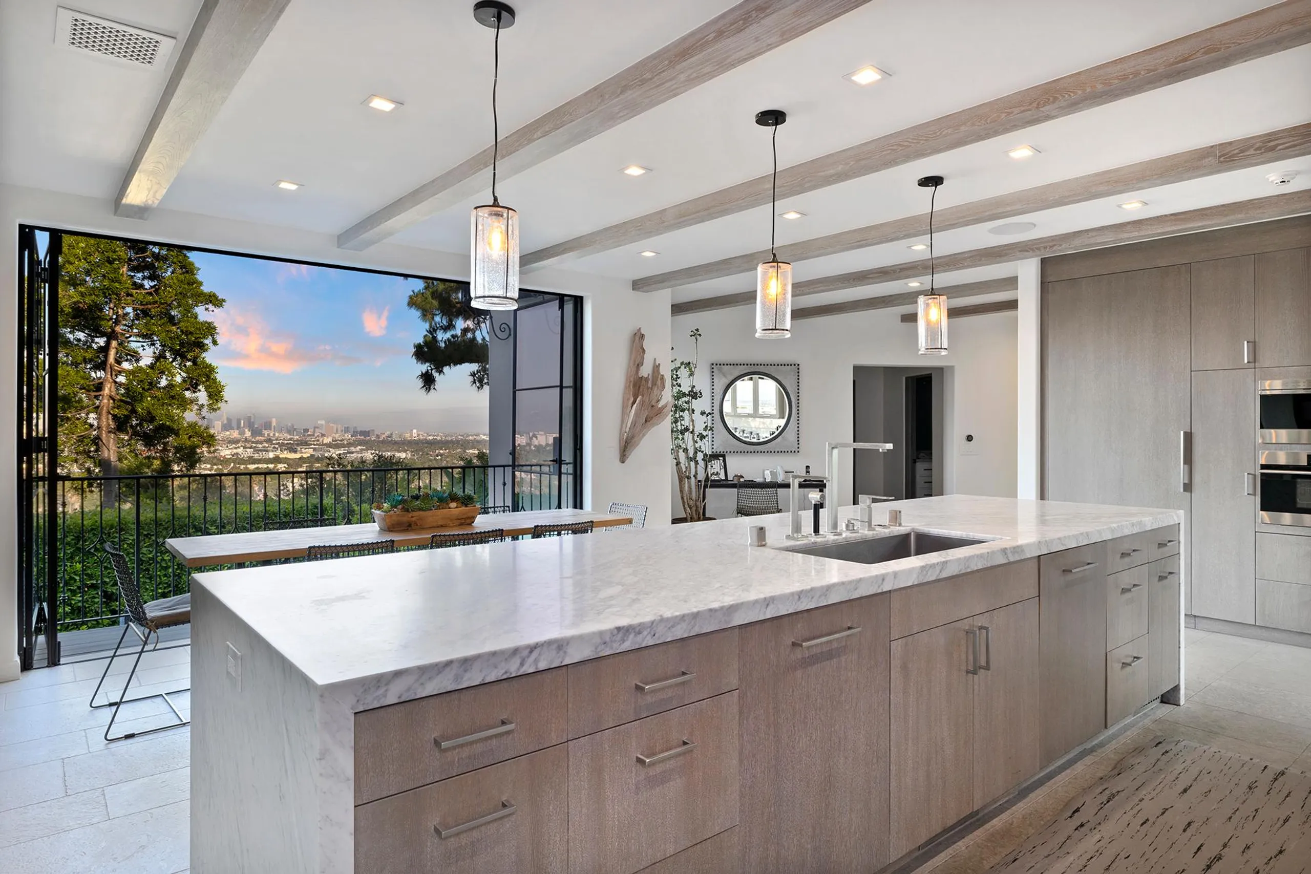 Mediterranean-Style Hollywood Hills Estate with Infinity Pool, Entertainment Room, and Panoramic Views — photograph 12