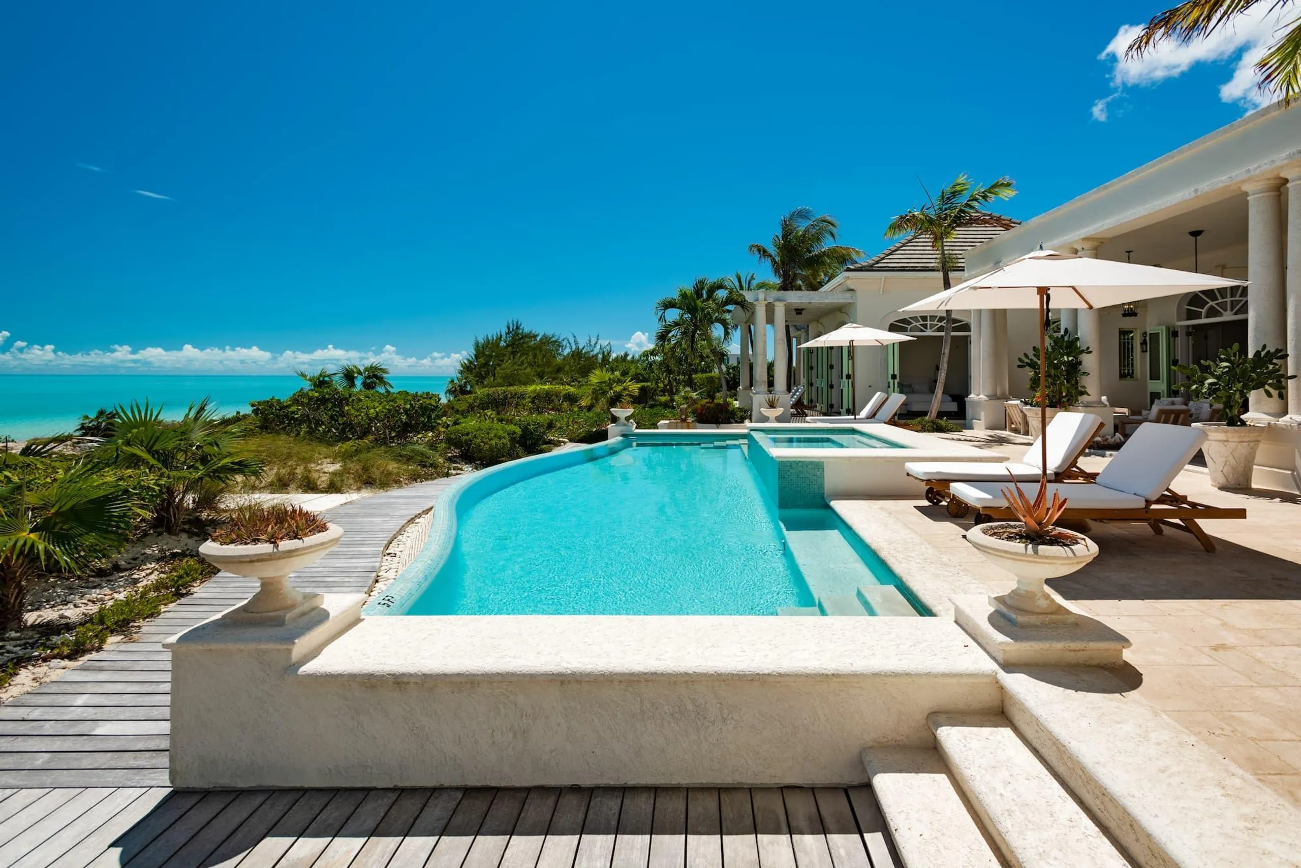Tranquil Beachfront Bliss Villa with Private Infinity Pool Steps from Ocean, Long Bay Beach