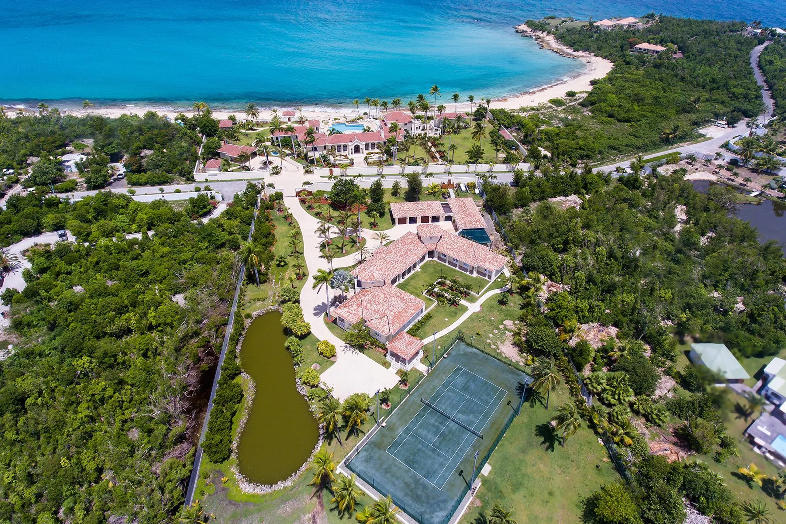 Luxury Redefined: Grand Luxe  Estate with Elegant Pool and Caribbean Views — photograph 8